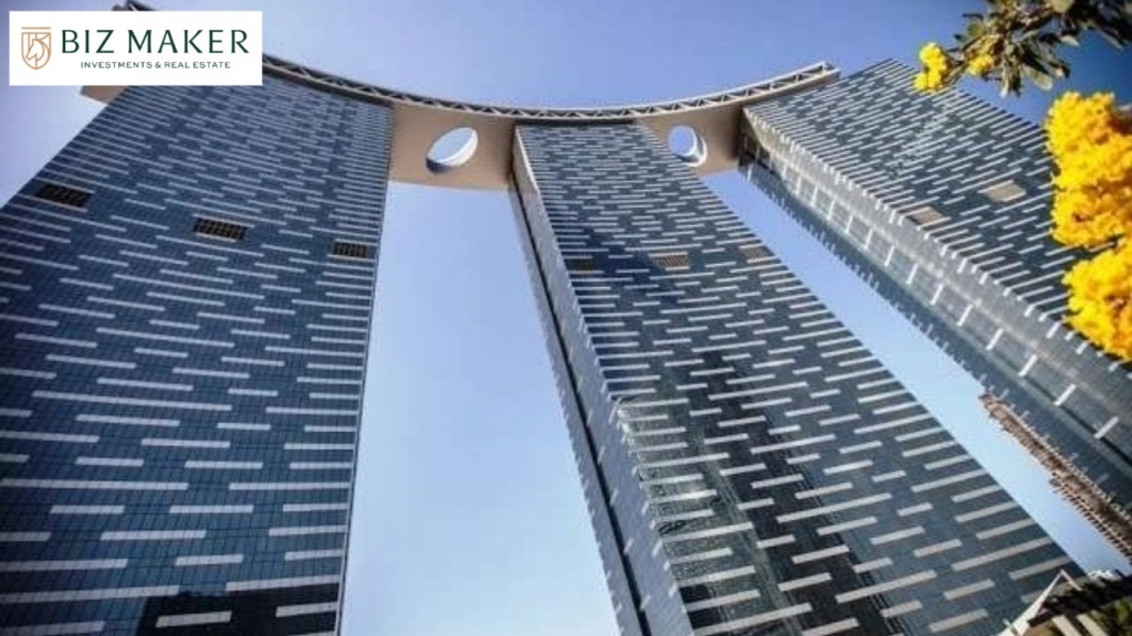 Iconic high-rise towers in Dubai Land Residence Complex with sky bridge architecture – premium investment property in Dubai