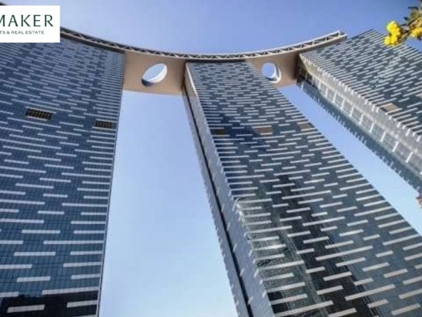 Iconic high-rise towers in Dubai Land Residence Complex with sky bridge architecture – premium investment property in Dubai